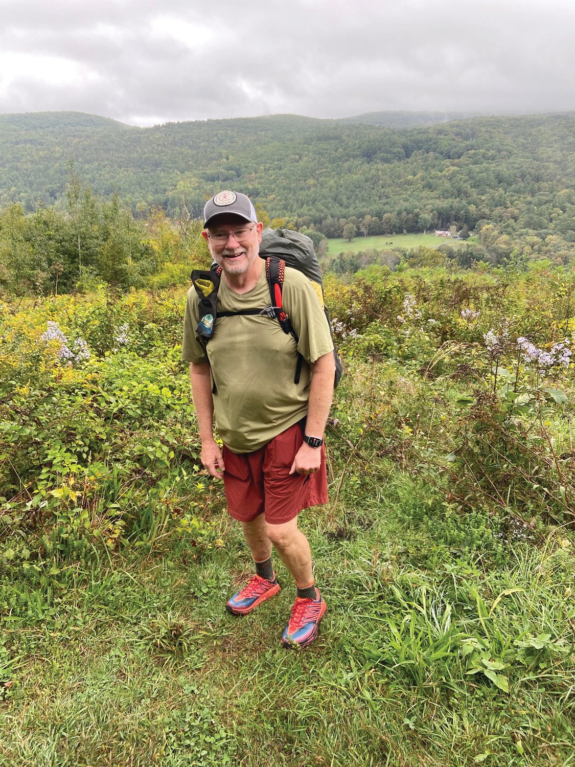 FULLY EQUIPPED:  Boblitt uses a lightweight pack and is selective about what it contains. He also opts for trail runners instead of traditional hiking boots which are much heavier.